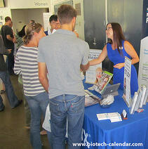 A sales rep discuss new products with life scientists at a past BioResearch Product Faire™ Event in Irvine.
