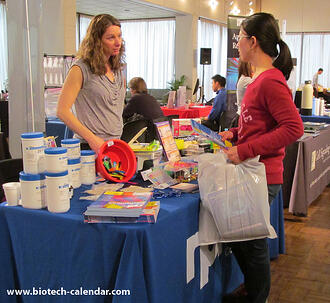 A TAMU researcher discusses new lab equipment with a lab supply vendor at the 2014 BRPF™ event.