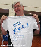 A happy researcher shows off his new Science Ninja shirt from a BCI event. 
