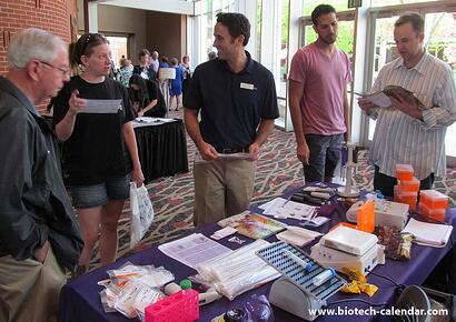 Researchers and lab suppliers discuss new products to further research work. 