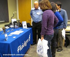 Researchers find new lab equipment at the Fred Hutchinson marketing event in Seattle. 