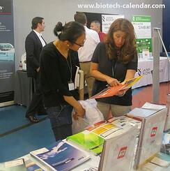 Exhibitors marketing products at 2014 Columbia event. 