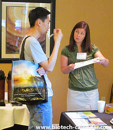 A researcher meets face-to-face with a sales rep to learn about new lab supplies. 