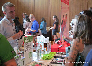 A lab supplier discuses his lab products with active life science researchers at the 2014 BioResearch Product Faire™ Event in Madison.  