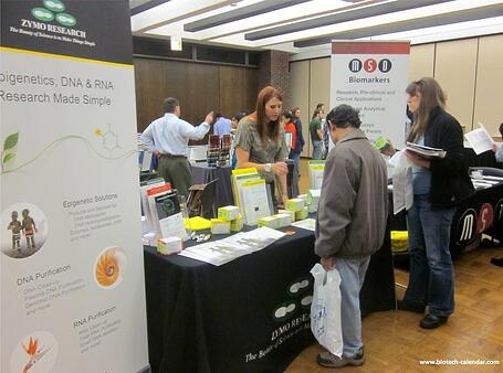 A lab supplier discusses lab supplies with interested researchers at a past BioResearch Product Faire™ Event. 