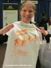 One researcher shows off her new Science Ninja tee at a UCSF Biotechnology Vendor Showcase™ Event. 