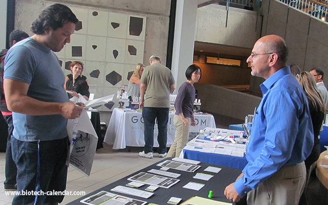 Researchers at last year's event discussing new lab equipment with specialists
