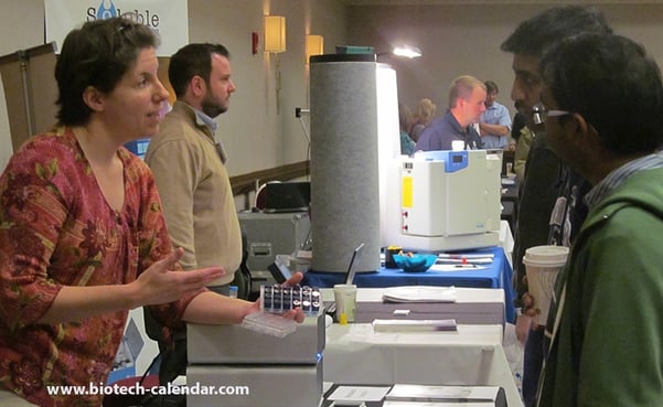 Researchers at our 2015 trade fair discussing new lab products with company specialists