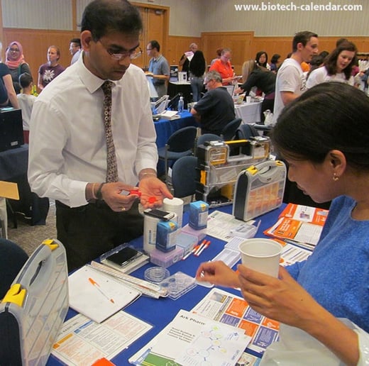 Life science vendors show products to scientists at the BioResearch Product Faire™ event in Ann Arbor, Michigan
